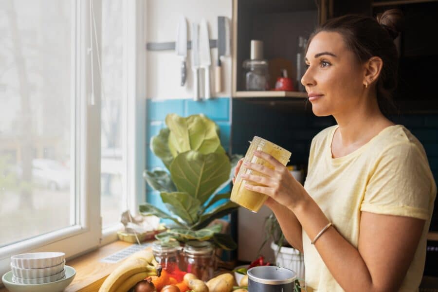 Woman with great oral health enjoying a nutritious snack in Rapid City, SD