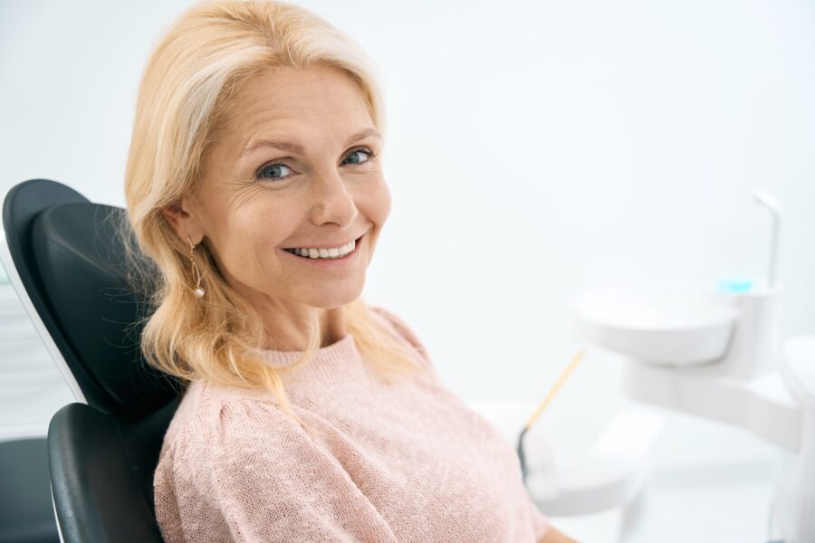 Woman with great smile after dental bridge treatment in Rapid City, SD